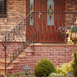 Exterior forged railing at the house entrance