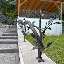 Stylish hand-forged railing and fencing with a forest motif Stylish hand-forged railing and fencing with a forest motif