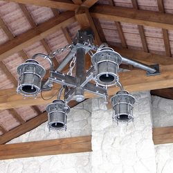 Exterior four-arm chandelier in a family house - hand-forged light