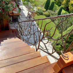 Design railing for stairs in the exterior of a family cottage – exceptional wrought-iron railings in high quality