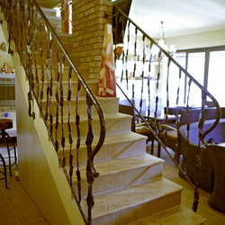 A wrought iron staircase railing