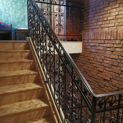 A luxury forged railing - staircase in an apartment hotel - interior railings
