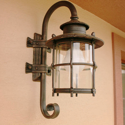 A wrought iron garden lamp with glass - luxury light
