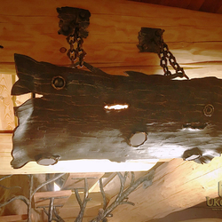 A wrought iron hanging light Bark - interior lighting