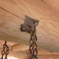 A wrought iron hanging light Bark - a detail