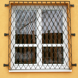 Wrought-iron grilles in the shape of waves on windows made in UKOVMI