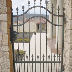 A forged gate as a part of family villa fence