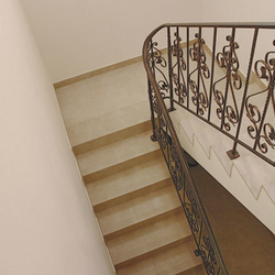 A wrought-iron staircase railing into the cellar – interior railing