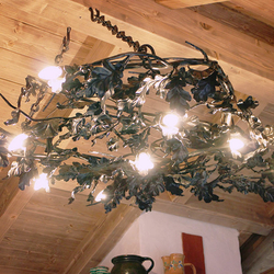 A luxury light - a wrought iron chandelier Oak