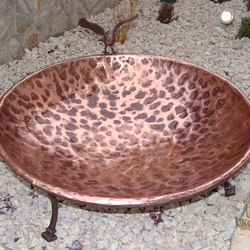 A copper wrought iron water fountain for birds
