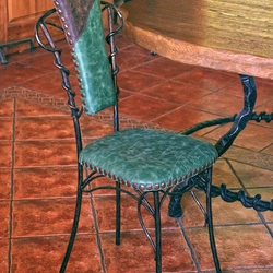Luxurious leather on a wrought iron chair