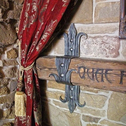 A wrought iron beam holder