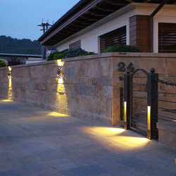 Entrance lighting in a wrought iron fence and luxury lights Bark