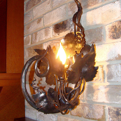 A side wrought iron cellar lamp