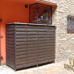 A wrought iron wood cabinet