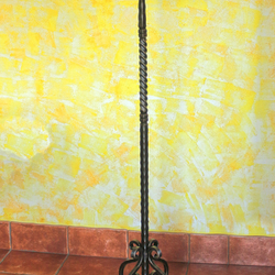 A rustic wrought iron hanger