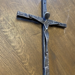 Forged wall cross as a symbol of Christianity