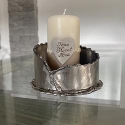 A stainless steel candleholder