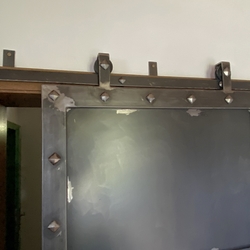 Forged sliding door in historic style