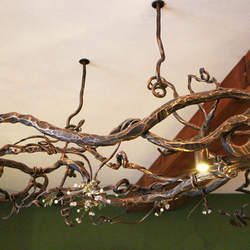 Exclusive hand-forged chandelier with the motif of nature in the hotel Galileo - Tatras