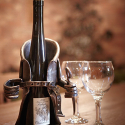 A wrought iron wine holder - a present