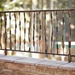 A wrought iron railing on a terrace